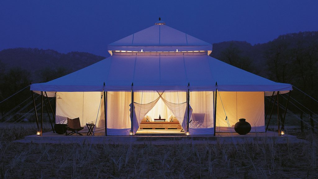 Glamping tent glowing softly at night