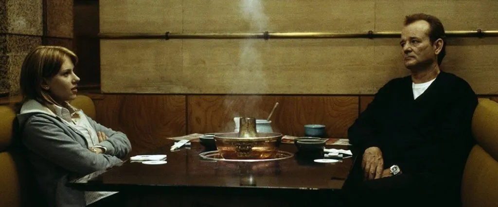 scene from lost in translation film, couple sat at table